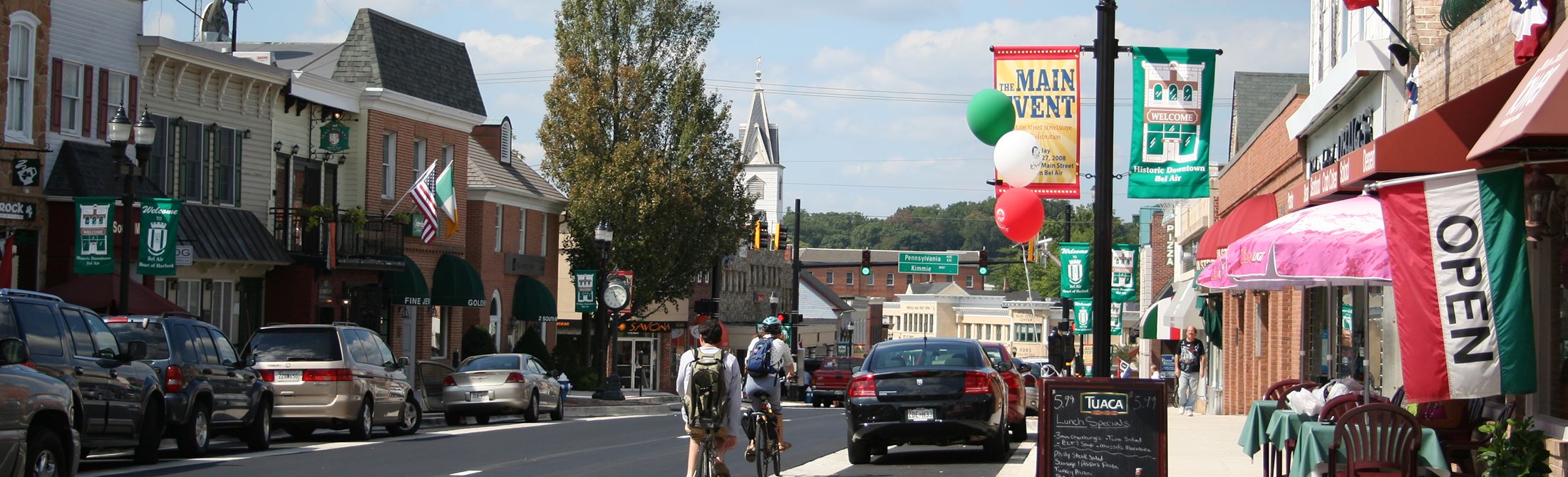 Harford main street with cars and people walking.