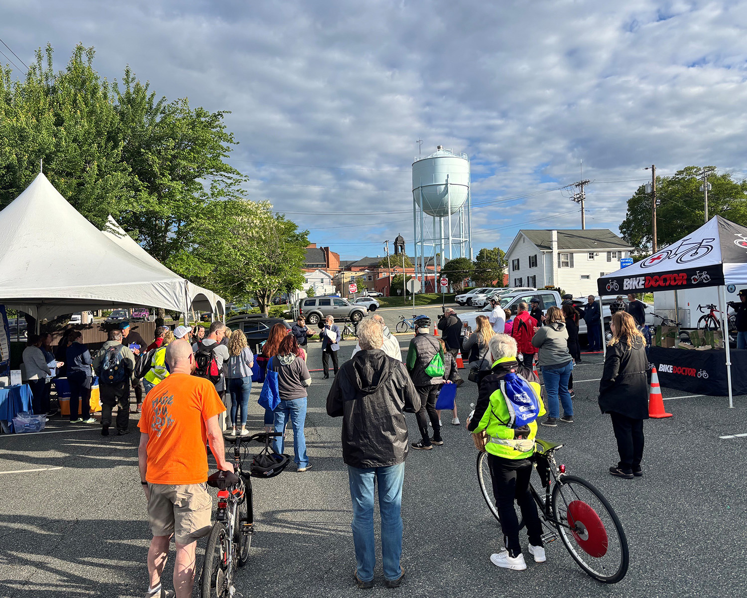 Harford county biking event picture showing tents and bicyclists around.